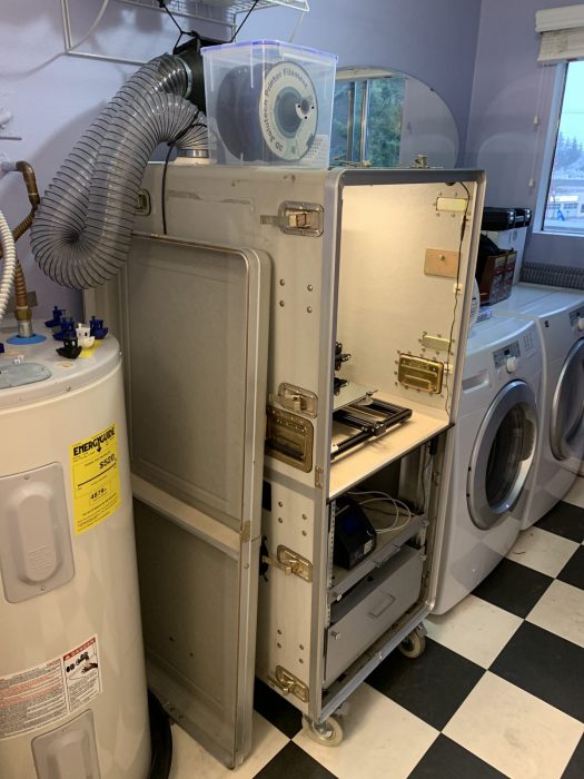 Enclosure in it's laundry room home.